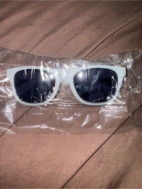 Clear Xfinity sunglasses with dark lenses